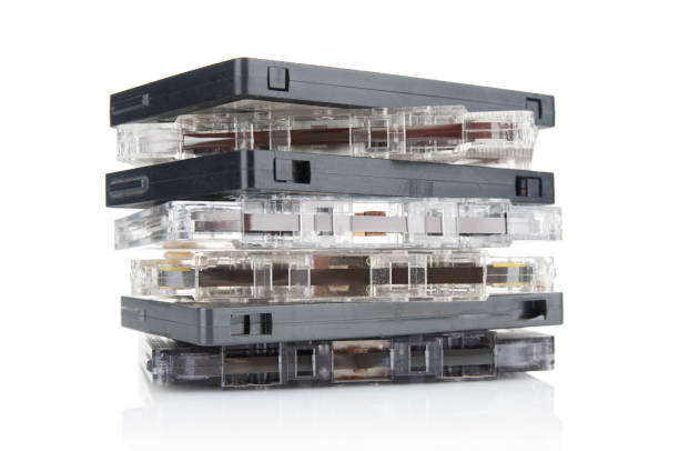 istock Stack of old vintage audio cassettes close up isolated on white background 1486347294