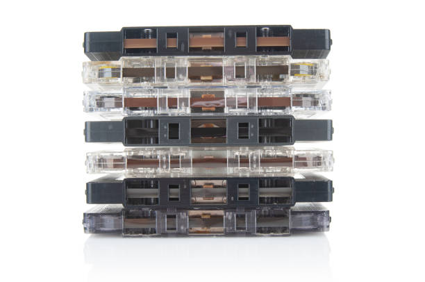 istock Stack of old vintage audio cassettes close up isolated on white background 1486348785