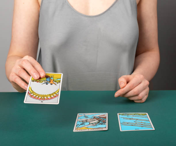 istock Lodz Poland April 15 2023 Tarot reader, fortune teller with taro cards during divination, future telling, reading 1486350804