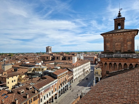 View of rooftop tiles of Ferrara with ancient buildings, seen from castello