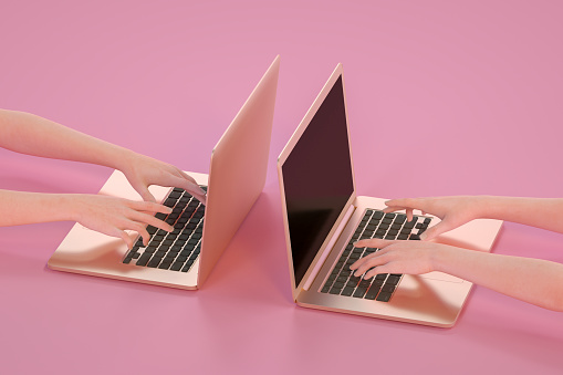 Two female hands using laptop. Digitally generated image.