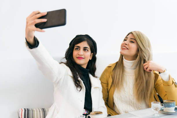istock Two Muslim friends making selfie 1486355979