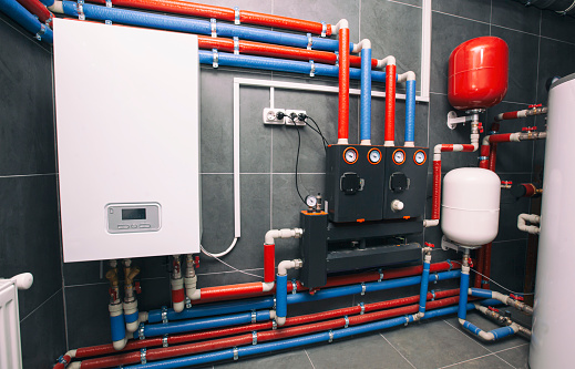 A modern electic boiler room. Equipment for modern heating system as a boiler, heater,pipes, expansion tank and other