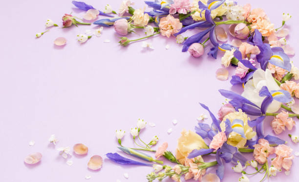 istock beautiful spring flowers on paper background 1486360629