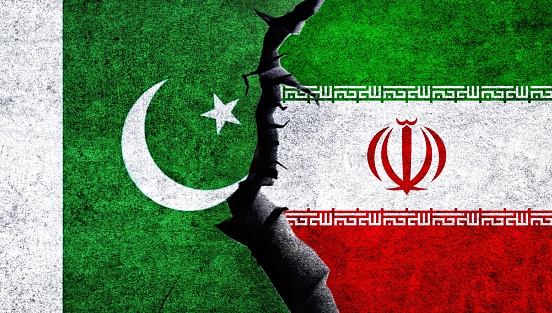 Iran vs Pakistan concept flags on a cracked wall. Pakistan Iran political conflict, economy, war crisis, relations, trade concept