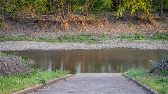 boat ramp on Lamine River in early spring at Roberts Bluff Access near Blackwater, Missouri