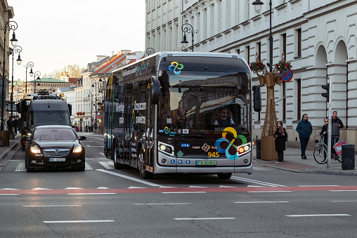 Warsaw, Poland - 3rd November, 2022: Hydrogen / fuel-cell bus Nesobus driving on a street. The hydrogen replaces gasoline as fuel in future.