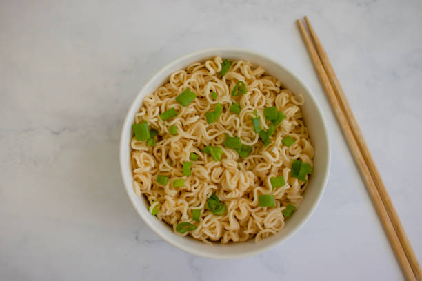 istock Noodles with green onions on backgroun 1486367854