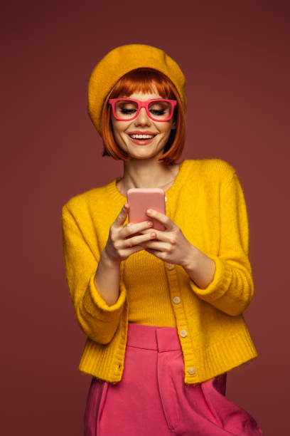 istock Beautiful emotional woman using phone 1486367951