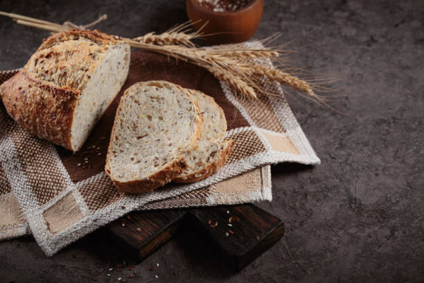 istock Sliced fresh baked whole grain bread with flax seeds 1486369380