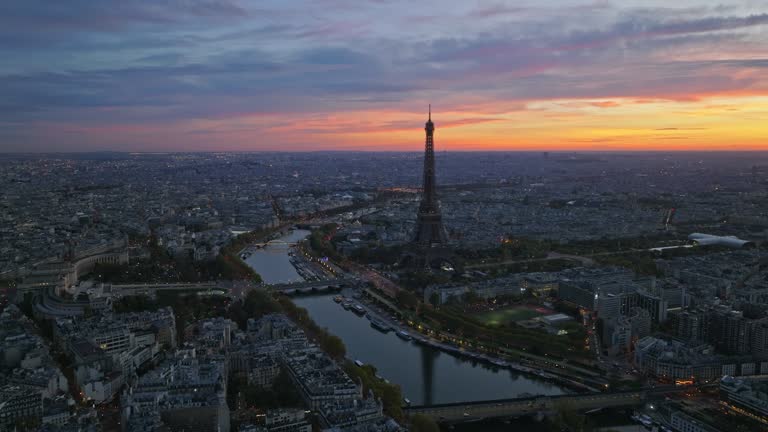 Aerial view of famous Eiffel Tower in Paris, France with twilight romantic sky.