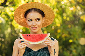 Beautiful girl enjoying watermelon