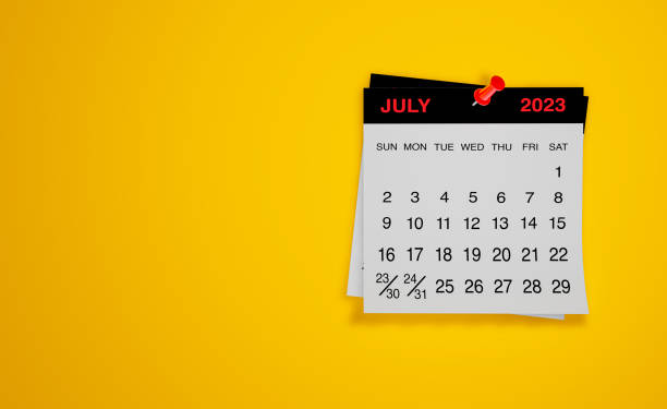 Desk calendar on wood background