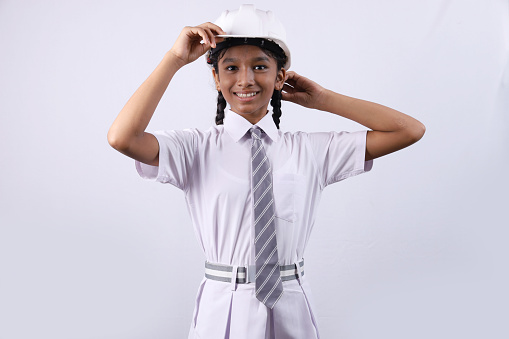 Asian woman construction worker portrait in studio