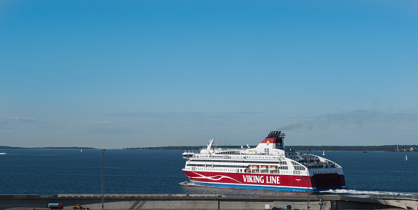 Tallinn, Estonia - August 9, 2023:A photograph of the Viking xprs cruiseship ferry leaving Tallinn port in Estonia, taken summer 2022 on a clear and sunny day.
