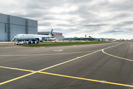 An Air Canada airplane parked at runway of Pearson International Airport, Ontario, Canada.