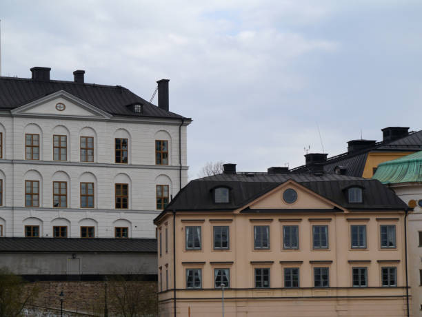 istock View of old buildings against cloudy sky 1486391667