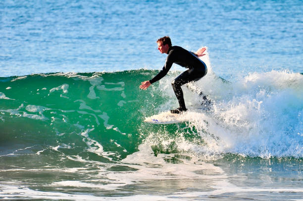 istock Surfer Racing across a Green Wave 1486394663