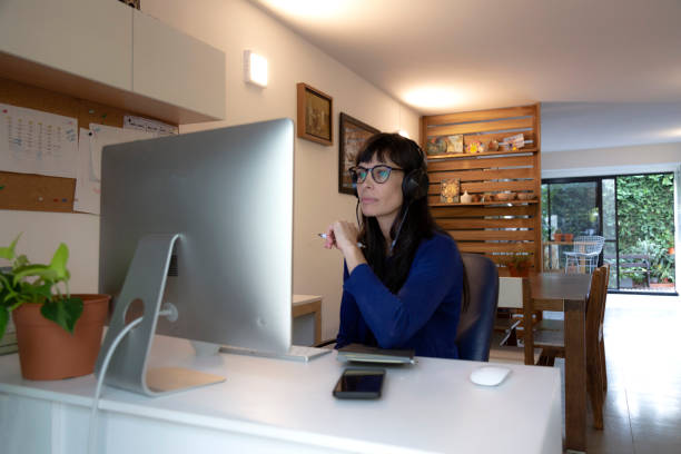 istock woman in front of a desktop computer 1486402354