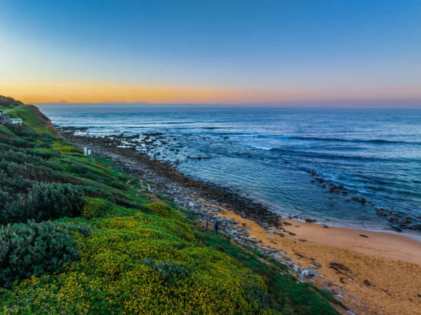 istock Aerial sunrise seascape with a hazy clear sky 1486410124