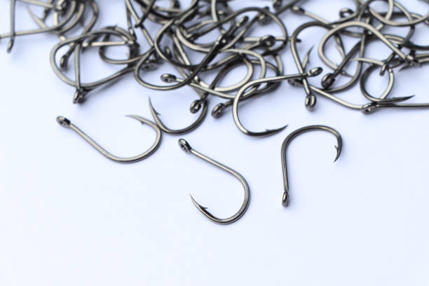 istock close up shot of fish hook on white background 1486413592