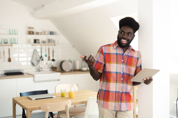 istock Portrait of a young African American using tablet at home 1486413599