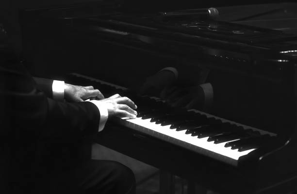 istock pianist playing on grand piano 1486413744