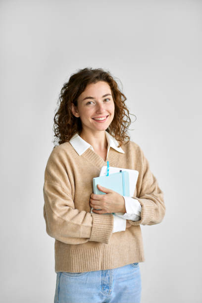 istock Young happy pretty cute girl student holding digital tablet. 1486413995