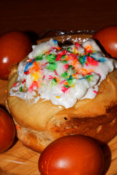 istock Homemade paska with colored Easter eggs and willow twig. 1486419892