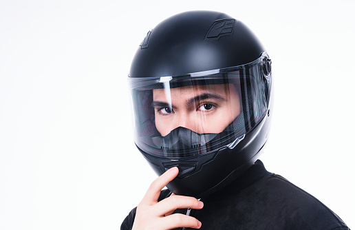 Image of young Asian man with helmet on background