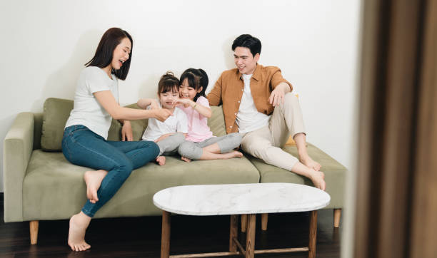 istock Young Asian family at home 1486433413