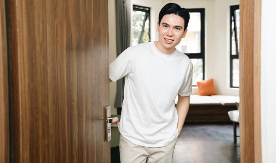 Image of young Asian man at home