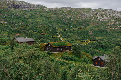 Scenic view of Norwegian village with moss covered roofs in mountains
