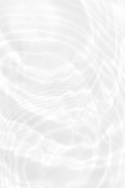istock White water with ripples on the surface. Defocus blurred transparent white colored clear calm water surface texture with splashes and bubbles. Water waves with shining pattern texture background. 1486454264