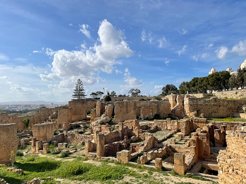 The sunny stone ruins of the Punic palace in Carthage, on Byrsa Hill, with a blue sky, near Tunis, Tunisia