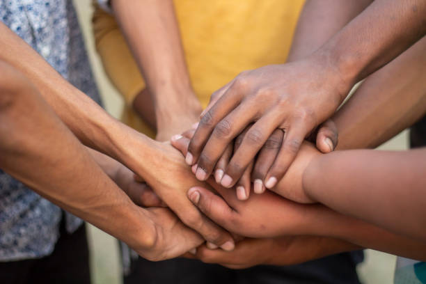 istock One hand down and the other hands on top of that hand 1486458733