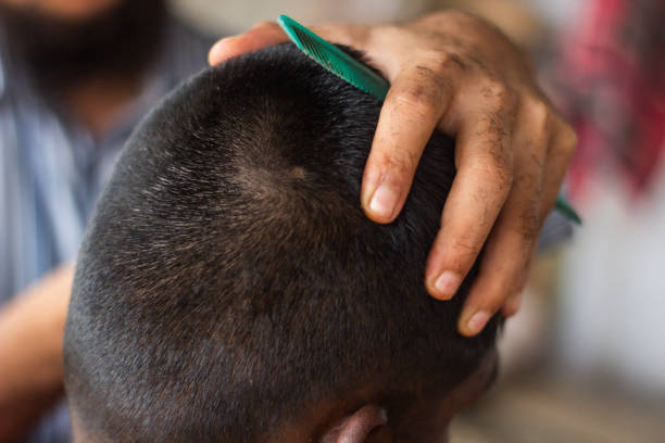istock A man is cutting a boy's hair and the background is blurred 1486459929