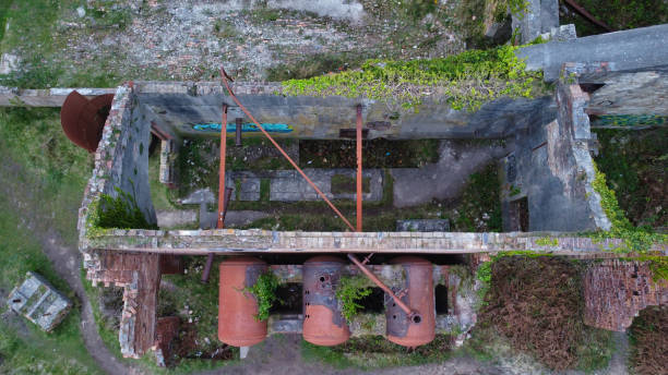 Aerial view of rusty boilers at disused Victorian brickworks on north Wales coast, Porth Wen, Anglesey, Wales, Britain Drone point of view of abandoned industrial architecture abandoned place stock pictures, royalty-free photos & images