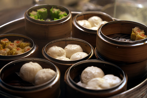 Variety of Chinese dim sum in bamboo steamers