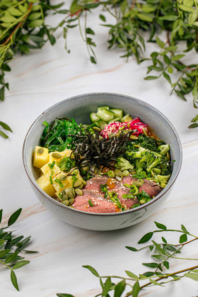 istock Portion of poke bowl with beef pastrami vegetables 1486470456
