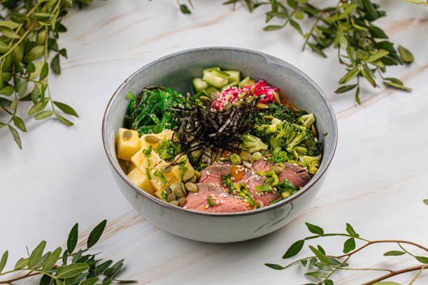 istock Portion of poke bowl with beef pastrami vegetables 1486470676
