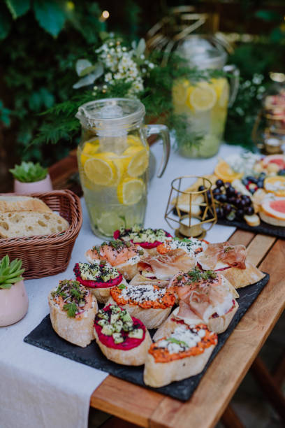 istock Dessert buffet at small wedding reception outside in the backyard. 1486474962