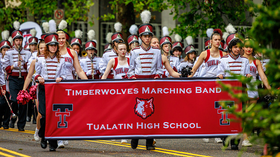 Portland, Oregon, USA - June 11, 2022: Tualatin High School Timberwolves Marching Band in the Grand Floral Parade, during Portland Rose Festival 2022.