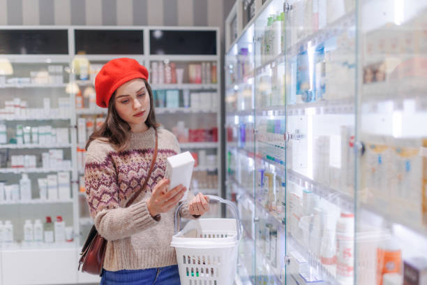 istock Young woman choosing a medication in pharmacy store. 1486483797