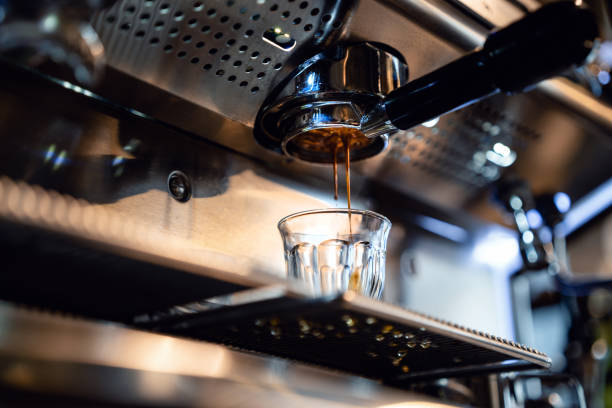 istock Espresso drops dripping from portafilter in small coffee shop 1486483962