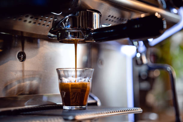 istock Espresso drops dripping from portafilter in small coffee shop 1486483966