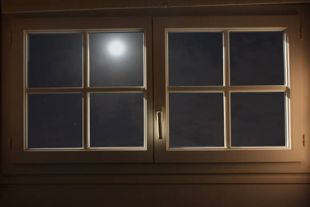 Full moon  Starry night seen through an apartment window