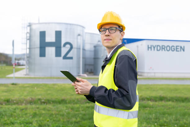 istock Engineer on a background of Hydrogen factory 1486486479