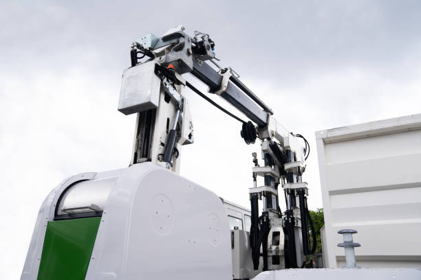 istock Garbage truck lifts street bin 1486487438