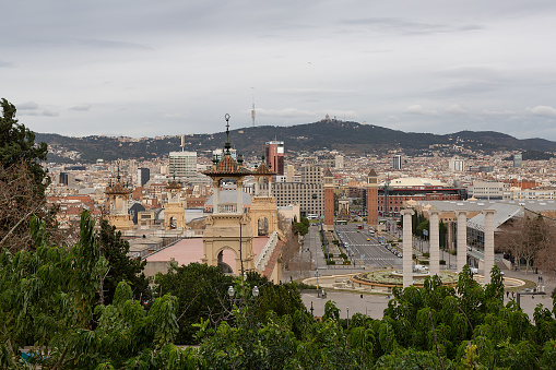 Barcelona, Spain - June 14, 2022:  Summer tourist crowd gathers in Park Guell designed by artist and architect Antoni Gaudi in Barcelona Catalonia Spain